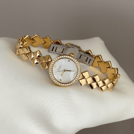 Diamond Sparkle: White Round Mother-of-Pearl Dial Watch with Gold Diamond Bezel & Gold Quilted Chain Bracelet