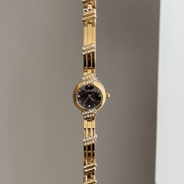 Sophistication Contrast: Black Round Dial Watch with Gold Round Bezel & Gold Stainless Steel Bracelet