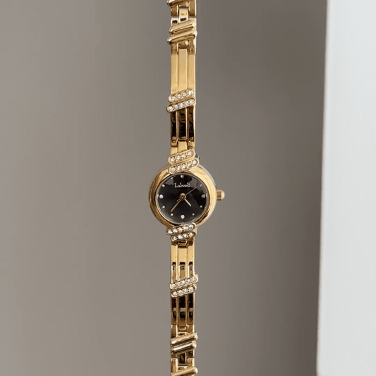 Sophistication Contrast: Black Round Dial Watch with Gold Round Bezel & Gold Stainless Steel Bracelet
