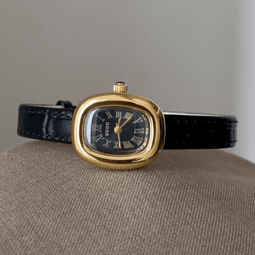Oval Elegance: Black Oval Dial Watch with Gold Oval Bezel & Black Genuine Leather Strap
