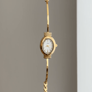 Oval Elegance: White Oval Dial Watch with Gold Bezel & Gold Chain Bracelet