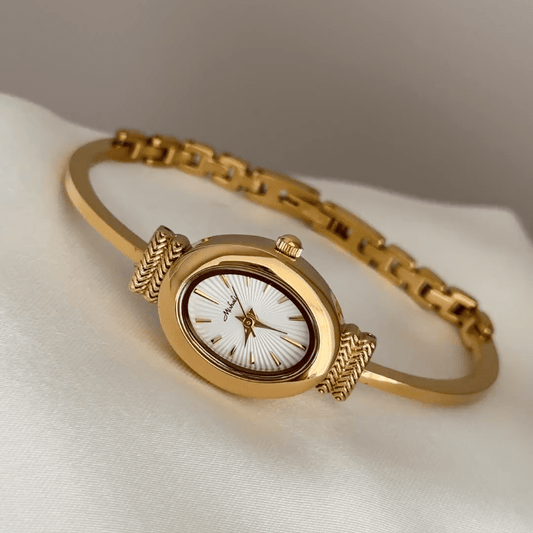 Oval Elegance: White Oval Dial Watch with Gold Bezel & Gold Chain Bracelet