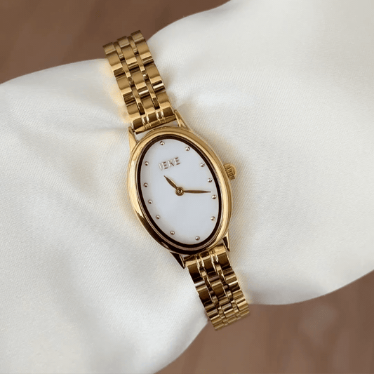 Oval Elegance: White Oval Dial Watch with Gold Oval Bezel & Gold Stainless Steel Bracelet