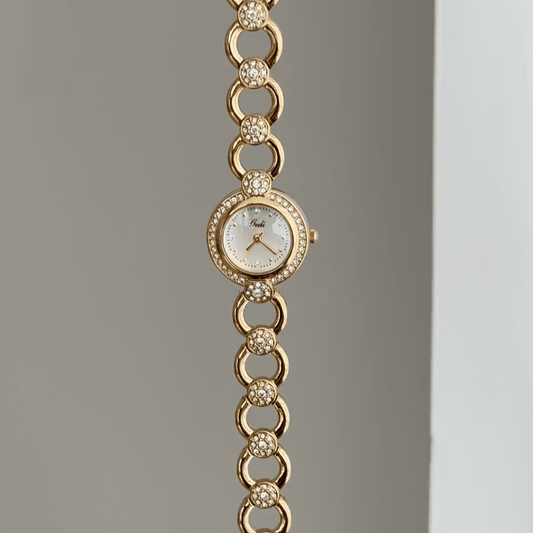 Openwork Airy: White Round Dial Watch with Gold Diamond Bezel & Gold Alloy Openwork Bracelet