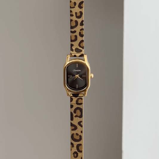 Leopard Edge: Black Oval Dial Watch with Gold Oval Bezel & Brown Leopard Print Steel Bracelet