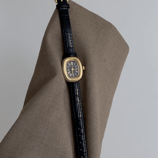 Oval Elegance: Black Oval Dial Watch with Gold Oval Bezel & Black Genuine Leather Strap