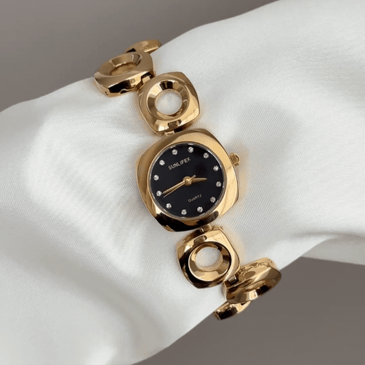 Geometric Contrast: Black Round Dial Watch with Gold Oval Bezel & Irregular Gold Bracelet