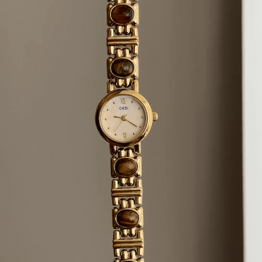 Gilded Warmth: Gold Round Dial Watch with Brown Gemstone Alloy Bracelet