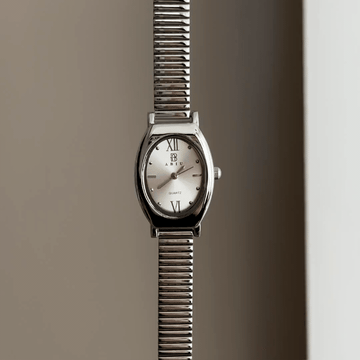 Versatile Elegance: Silver Oval Dial Watch with Silver Bezel & Stainless Steel Bracelet