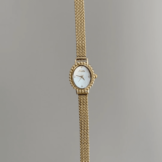 Luminous Pearl：White Mother-of-Pearl Oval Dial Watch – Gold Oval Bezel & Gold Stainless Steel Bracelet Quartzv