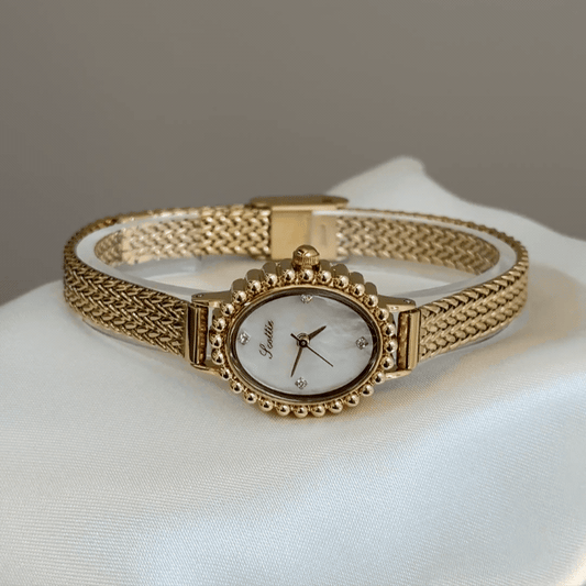 Luminous Pearl：White Mother-of-Pearl Oval Dial Watch – Gold Oval Bezel & Gold Stainless Steel Bracelet Quartzv