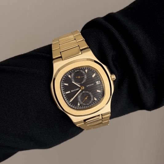 Sophisticated Edge: Black Round Dial Watch with Gold Oval Bezel & Stainless Steel Bracelet