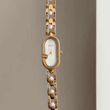 Pearl-Adorned Elegance: White Elongated Oval Dial Watch with Gold Bezel & Pearl-Accented Gold Chain Bracelet