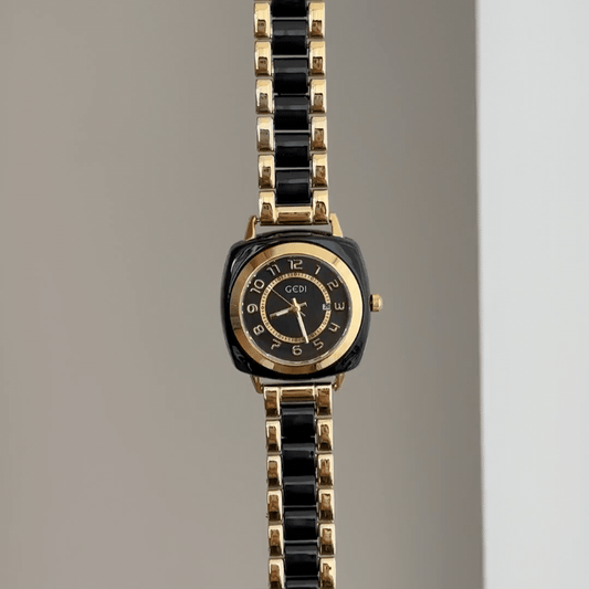 Geometric Contrast: Black Round Dial Watch with Black Rectangular Bezel & Gold-Black Alternating Alloy Bracelet