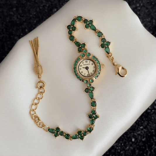 Emerald Luxe: Gold Round Dial Watch with Green Gemstone Bezel & Green Accent Bracelet