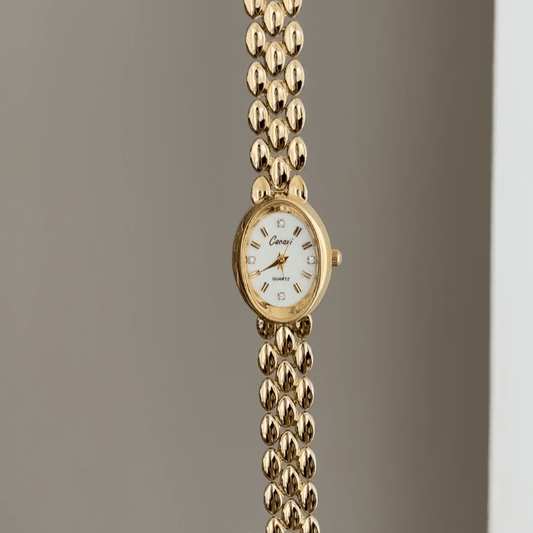 Warm Gold Elegant: White Oval Dial Watch with Gold Oval Bezel & Matching Bracelet