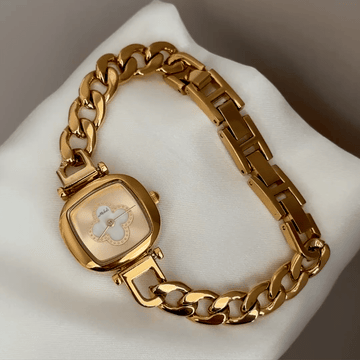 Gilded Elegance: Gold Oval Dial Watch with Gold Chain Bracelet
