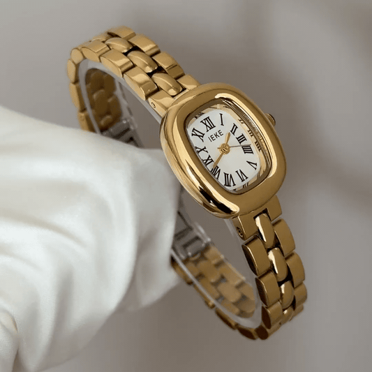 Classic Grace Elegant: White Oval Dial Watch with Gold Bezel & Stainless Steel Bracelet