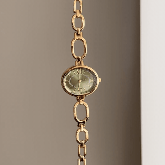 Luxe Shine: Green Oval Dial Watch with Gold Alloy Chain Bracelet