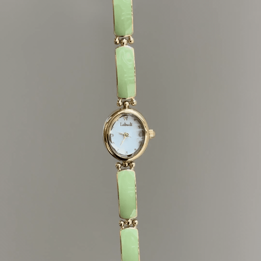 Artistic Flair：White Oval Dial Watch – Gold Oval Case & Green Stainless Steel Band Quartz