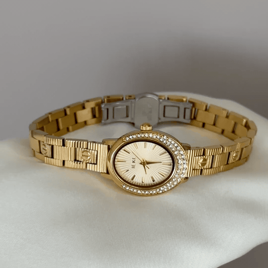 Luxurious Sparkle: Gold Oval Dial Watch with Gold Diamond Bezel & Gold Stainless Steel Bracelet