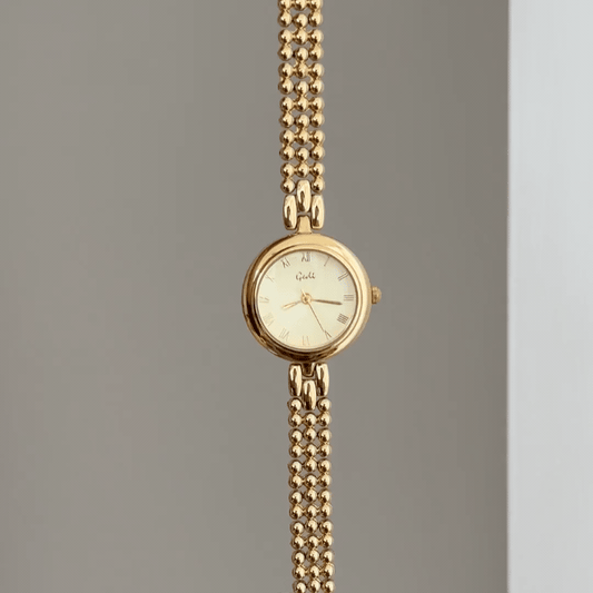 Classic Luxe: Gold Round Dial Watch with Matching Bezel & Gold-Tone Steel Bracelet