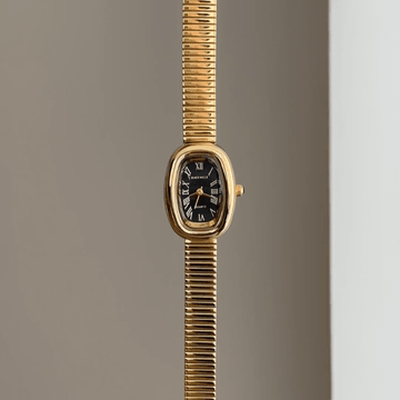 Vintage Edge: Black Oval Dial Watch with Gold Oval Bezel & Gold Stainless Steel Bracelet