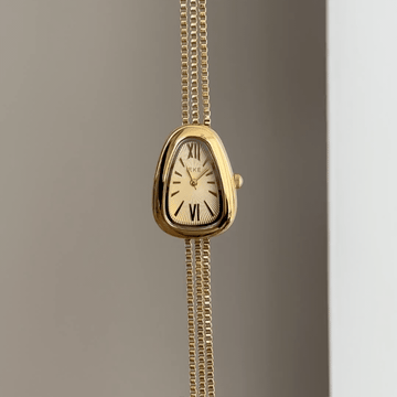 Chain Glamour: Gold Serpent Head Dial Watch with Matching Bezel & Gold Chain Bracelet