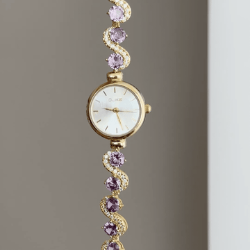Gilded Elegance: White Round Dial Watch with Gold Bezel & Purple Gemstone-Set Gold Bracelet