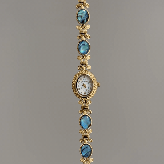 Oceanic Iridescence：White Oval Dial Watch – Gold Oval Bezel & Gold Abalone Shell Alloy Bracelet Quartz