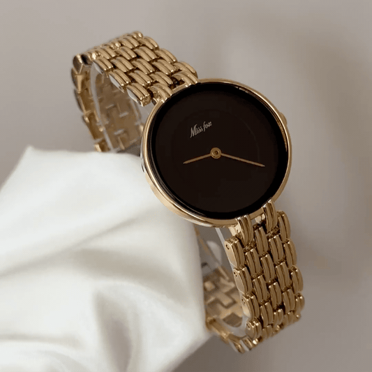 Luxe Contrast: Black Round Dial Watch with Gold Bezel & Gold Stainless Steel Bracelet