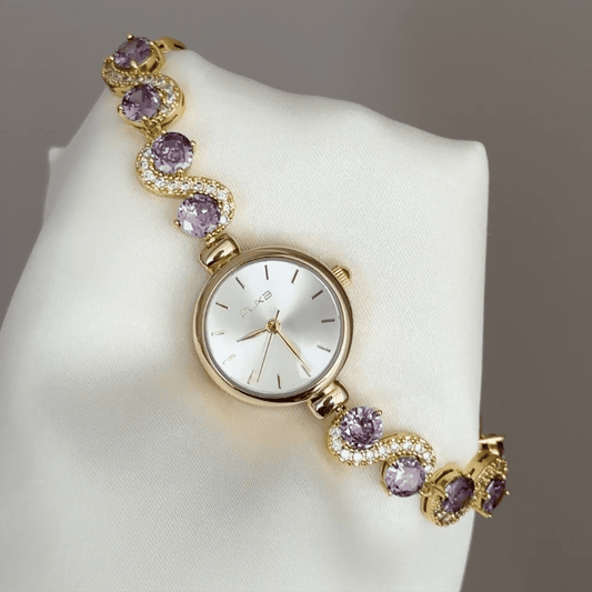 Gilded Elegance: White Round Dial Watch with Gold Bezel & Purple Gemstone-Set Gold Bracelet
