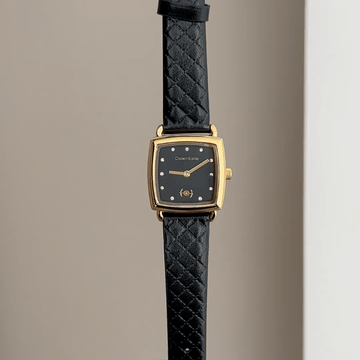 Timeless Chic: Black Rectangular Dial Watch with Gold Bezel & Black Leather Strap