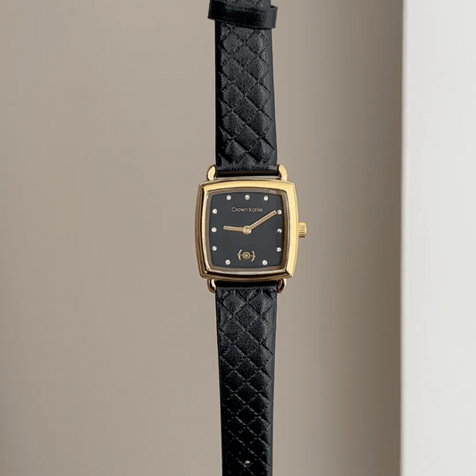 Timeless Chic: Black Rectangular Dial Watch with Gold Bezel & Black Leather Strap
