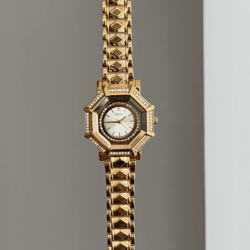 Geometric Glam: White Round Diamond Dial Watch with Gold Octagonal Diamond Bezel & Gold Bracelet