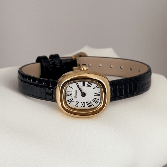 Feminine Luxury: White Oval Dial Watch with Gold Oval Bezel & Black Genuine Leather Strap