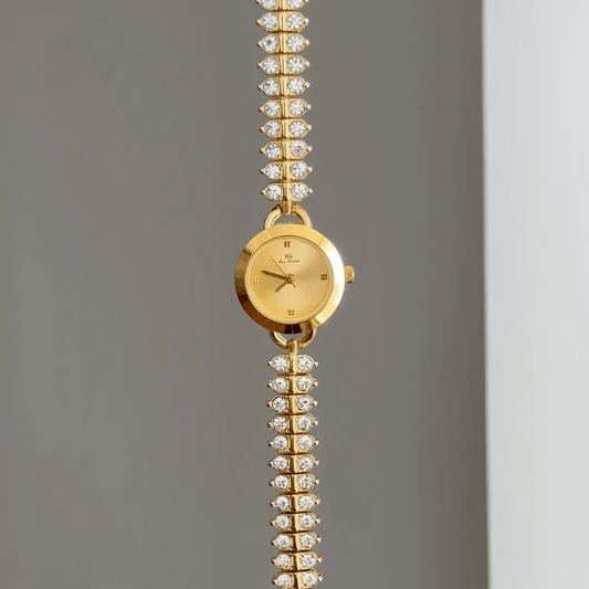 Diamond Sparkle: Gold Round Dial Watch with Gold Bezel & Diamond-Set Gold Chain Bracelet