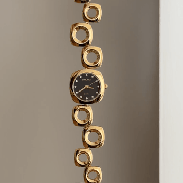 Geometric Contrast: Black Round Dial Watch with Gold Oval Bezel & Irregular Gold Bracelet