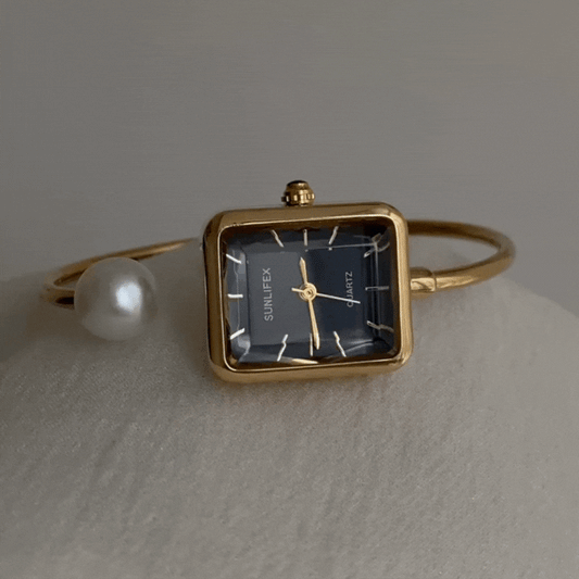 Noir Pearl – Black & Gold Bangle Watch with Pearl Accents