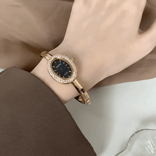 Luna Noir – Gold Oval Bangle Watch with Crystal Frame