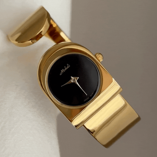 Vintage Vogue – Gold Wide Cuff Black Round Dial Women’s Quartz Watch