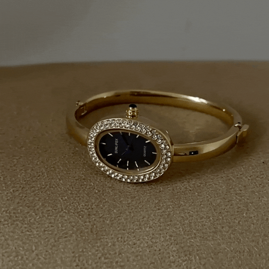 Luna Noir – Gold Oval Bangle Watch with Crystal Frame