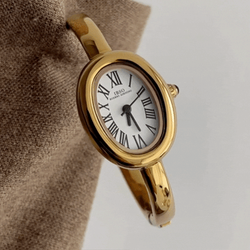 Gold Bangle Style with White Bathtub-Shaped Oval Dial Women’s Quartz Watch
