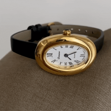 Golden Grace Timepiece: Oval Roman Numeral Dial with Black Strap