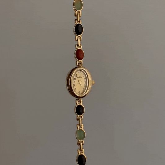 Elegance in Motion – Gold Oval Watch with Jade Bracelet