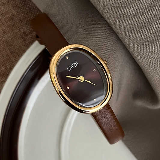 Elegant Latte Brown Thin Strap Women’s Quartz Watch with Oval Gold Case & Small Dial
