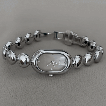 Reloj de cuarzo de brazalete con cuentas ovaladas para mujeres - elegante y moderno