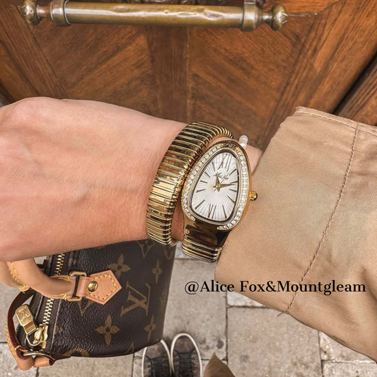 Golden Serpenti Bracelet Watch: Elastic Band with Diamond-Accented White Dial