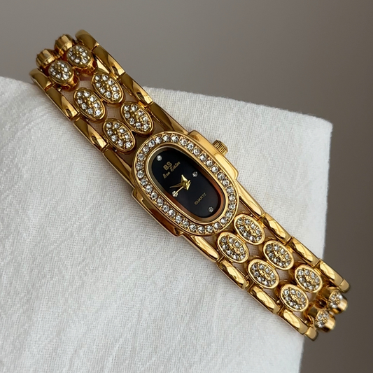 Gold Wide Strap Watch with Diamond-Accented Case & Black Oval Dial – Women’s Quartz Watch