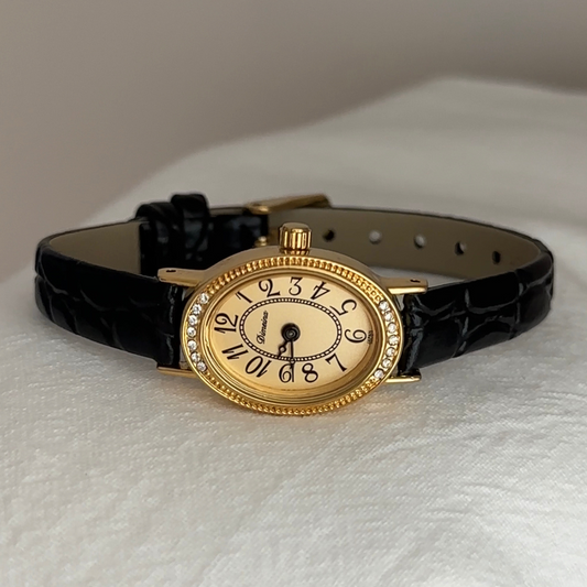 Elegant Fashion Black Leather Strap Women’s Quartz Watch with Oval Gold Diamond-Accented Dial